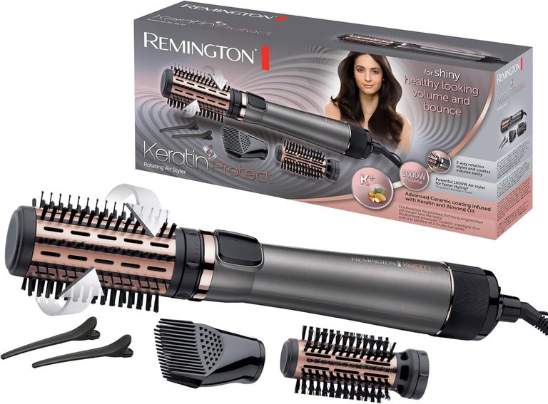 Remington Keratin Protect AS8811 Warmluftbürste mit alles Aufsätzen und dem Karton im Hintergrund 